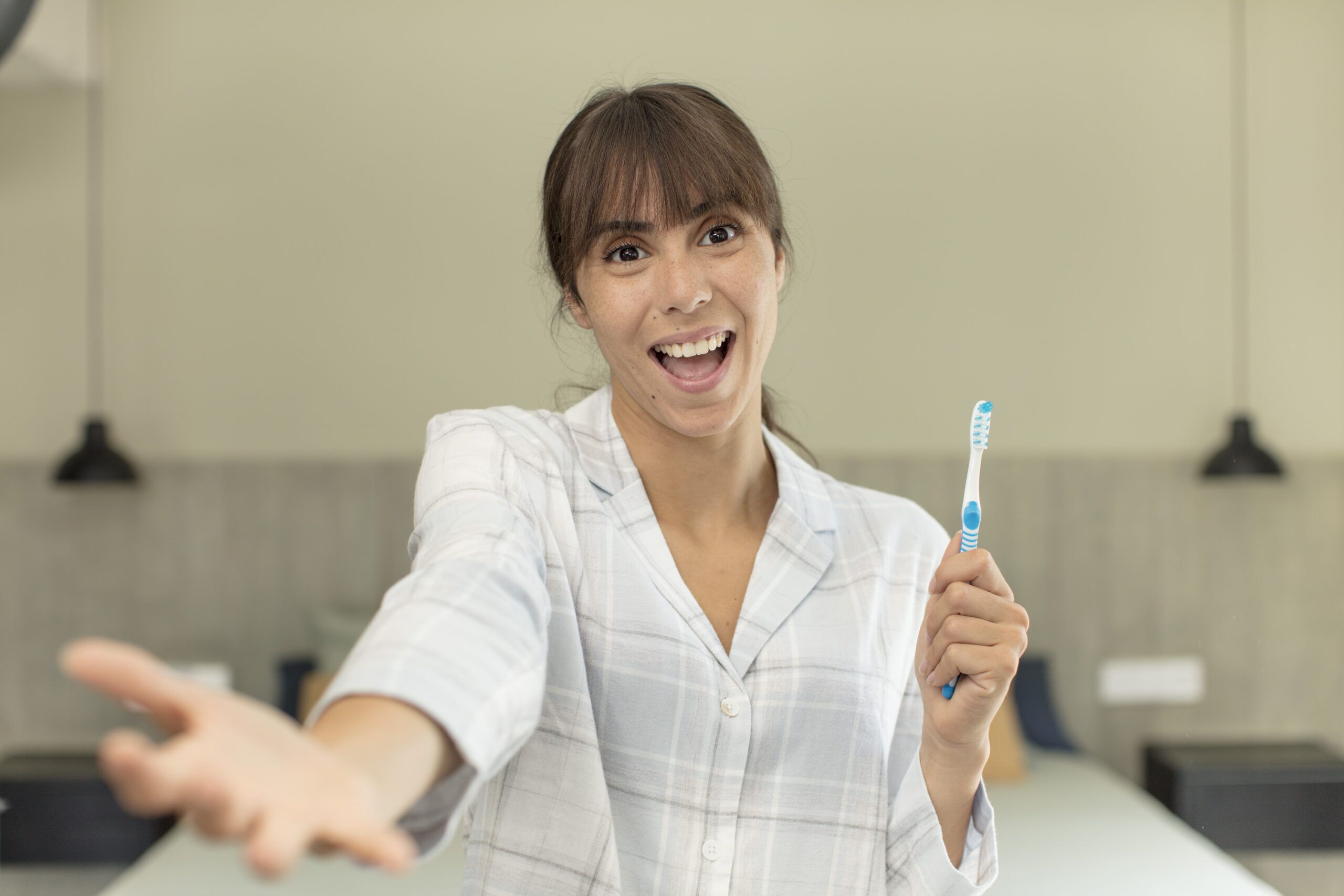 young pretty woman smiling happily and offering or showing a concept. mouthwash concept