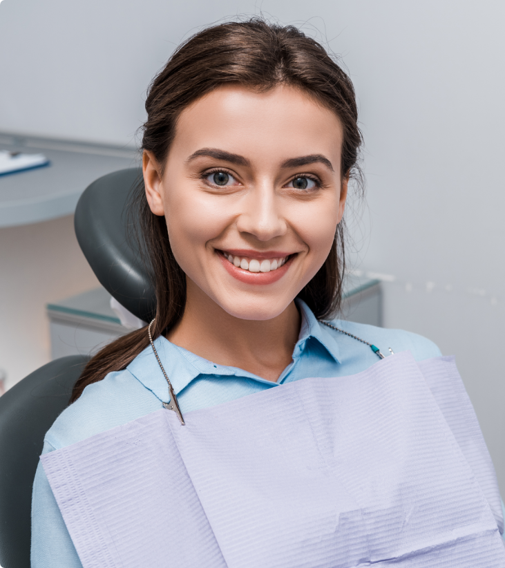 Smiling patient seated in dental chair